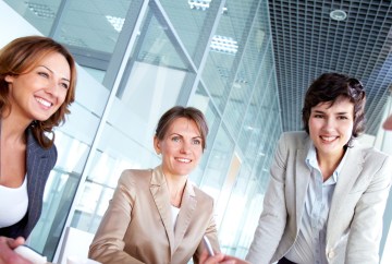 Professional women at a conference table