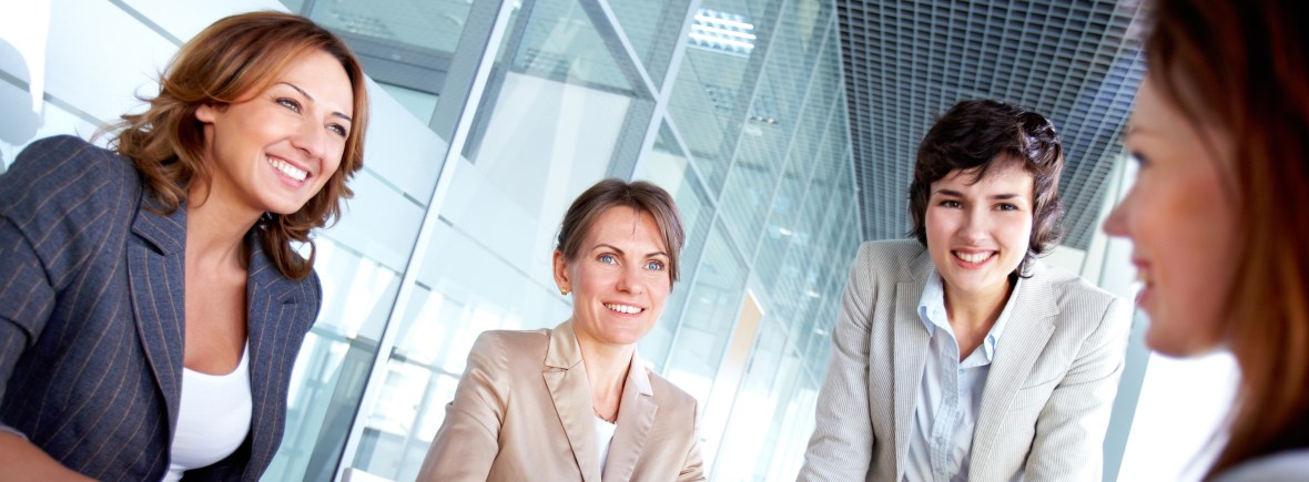 Professional women at a conference table